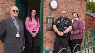 Councillor Paul Taylor, Eleanor Smalley, Sergeant Rob Harrison and PCC Caroline Henry next to the new intercom system