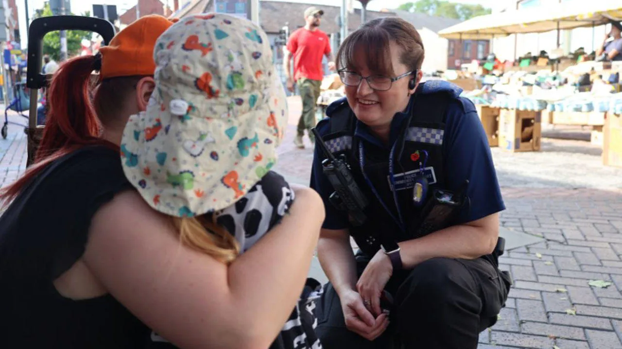 An officer talking to members of the public at the Worksop day of action