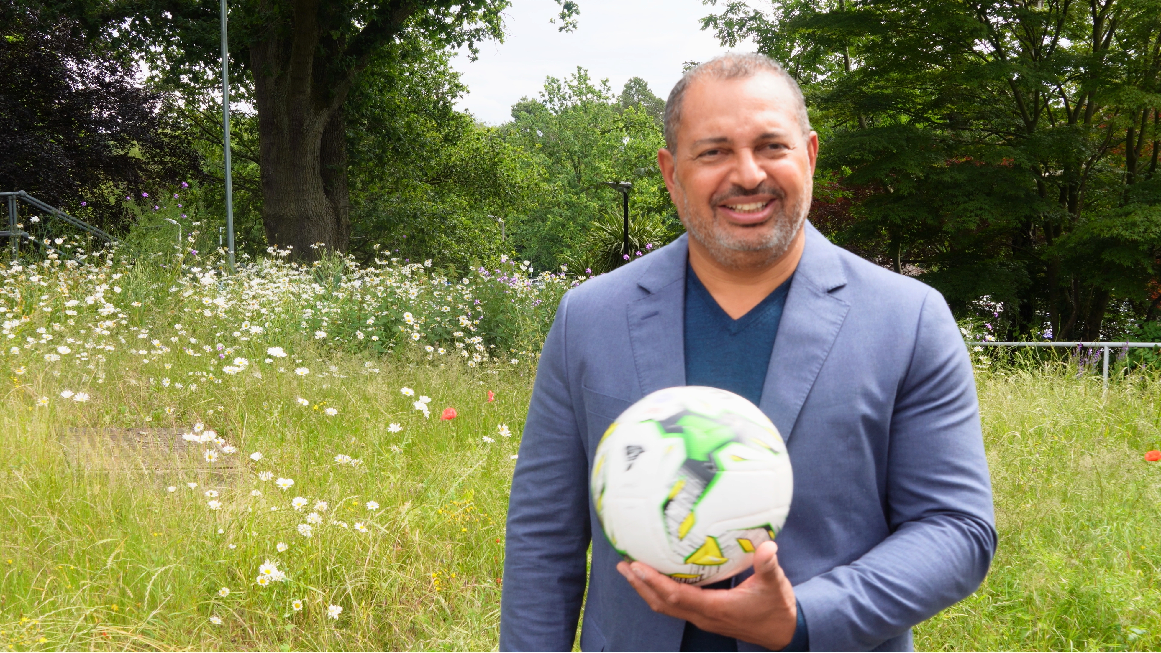 PCC Gary Godden holding a football