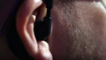 Police Officer with earpiece in