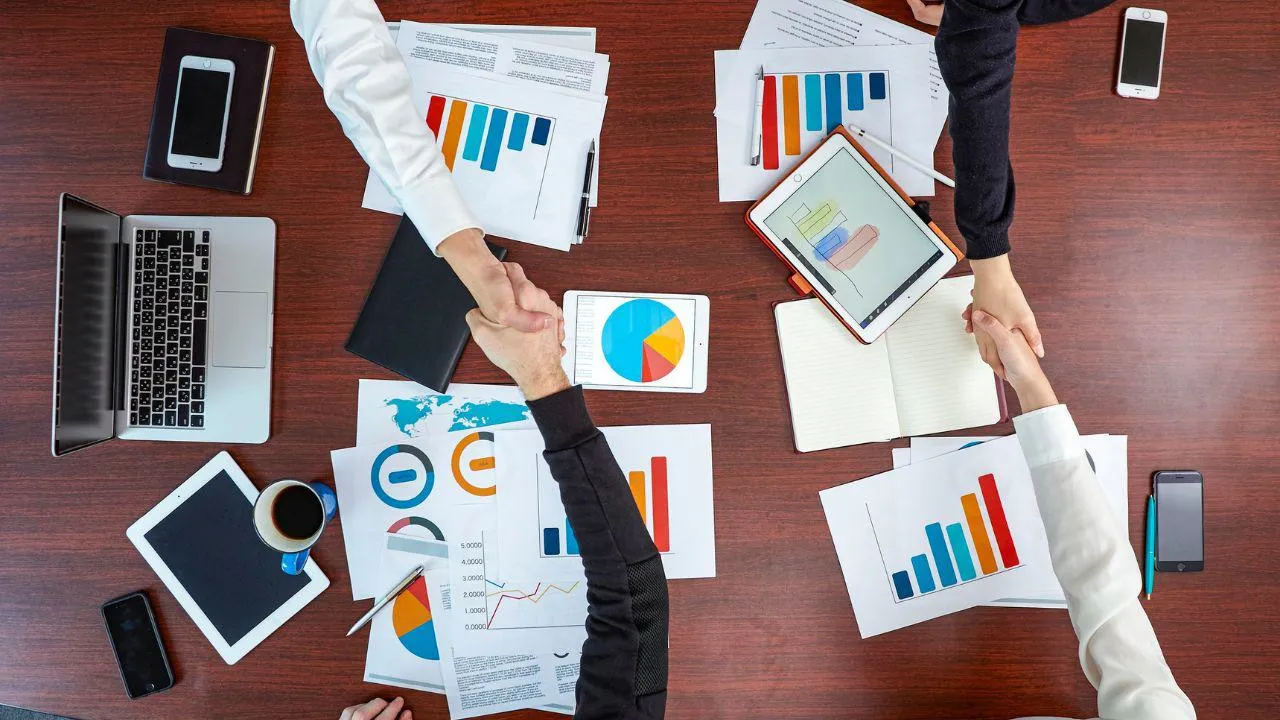 Shaking hands across a table