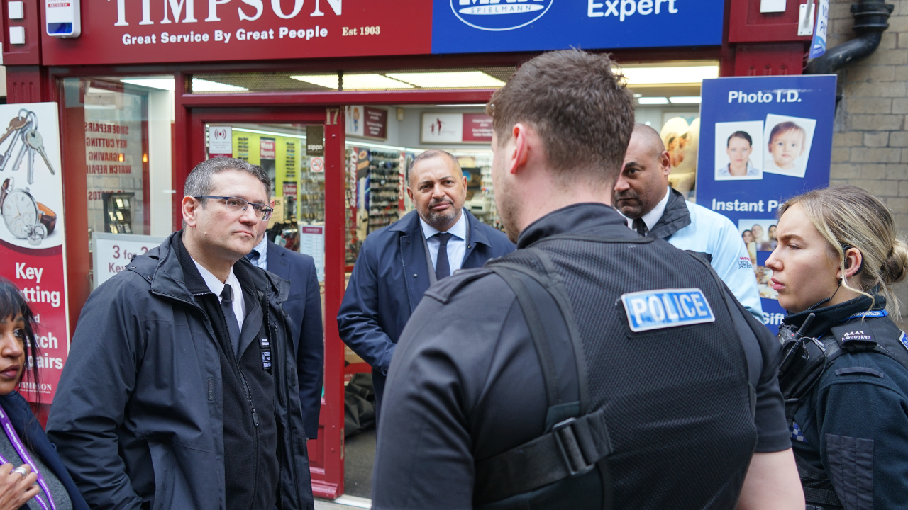 Commander Stephen Clayman talking to local officers.