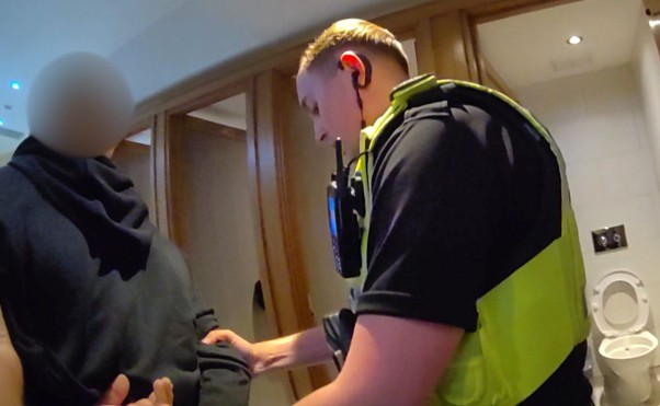 An officer carrying out an arrest.