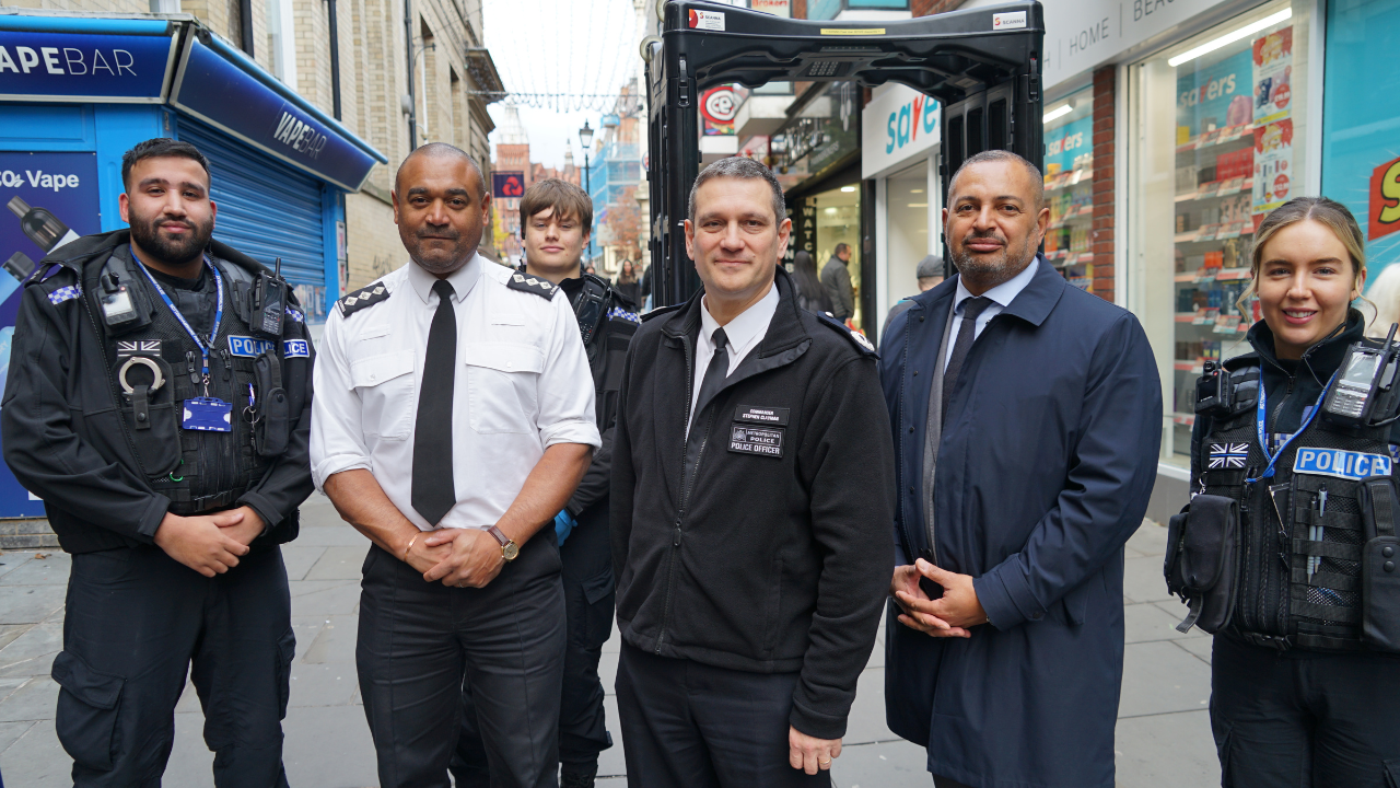 Commander Stephen Clayman (centre) with PCC Gary Godden and local officers.