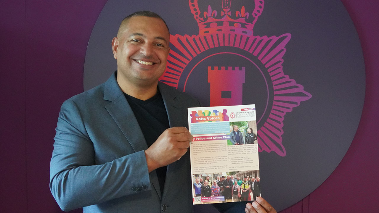 Police and Crime Commissioner Gary Godden holding his first Notts Voices newsletter