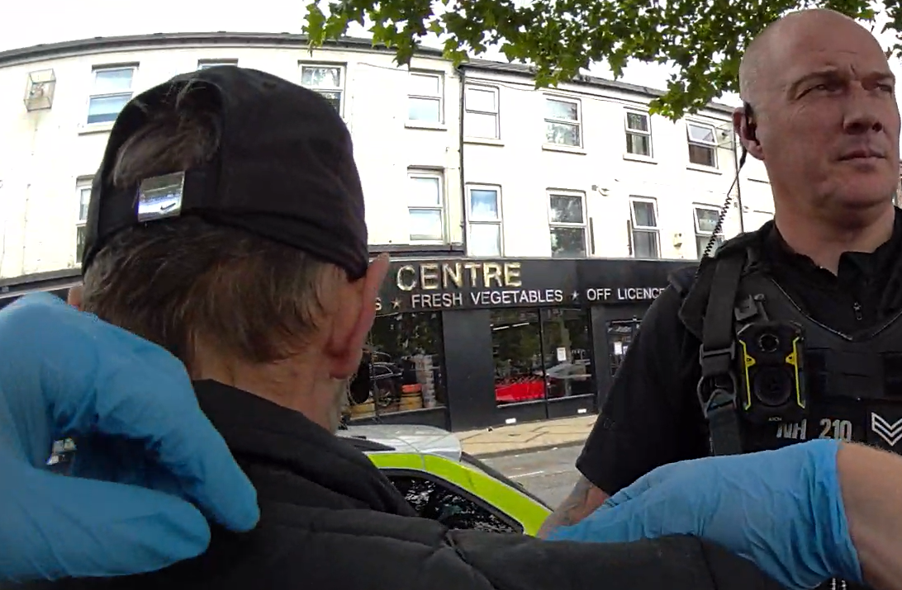 Police execute an arrest.