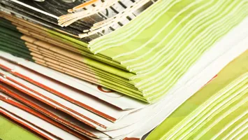 a stack of brochures - to represent publications