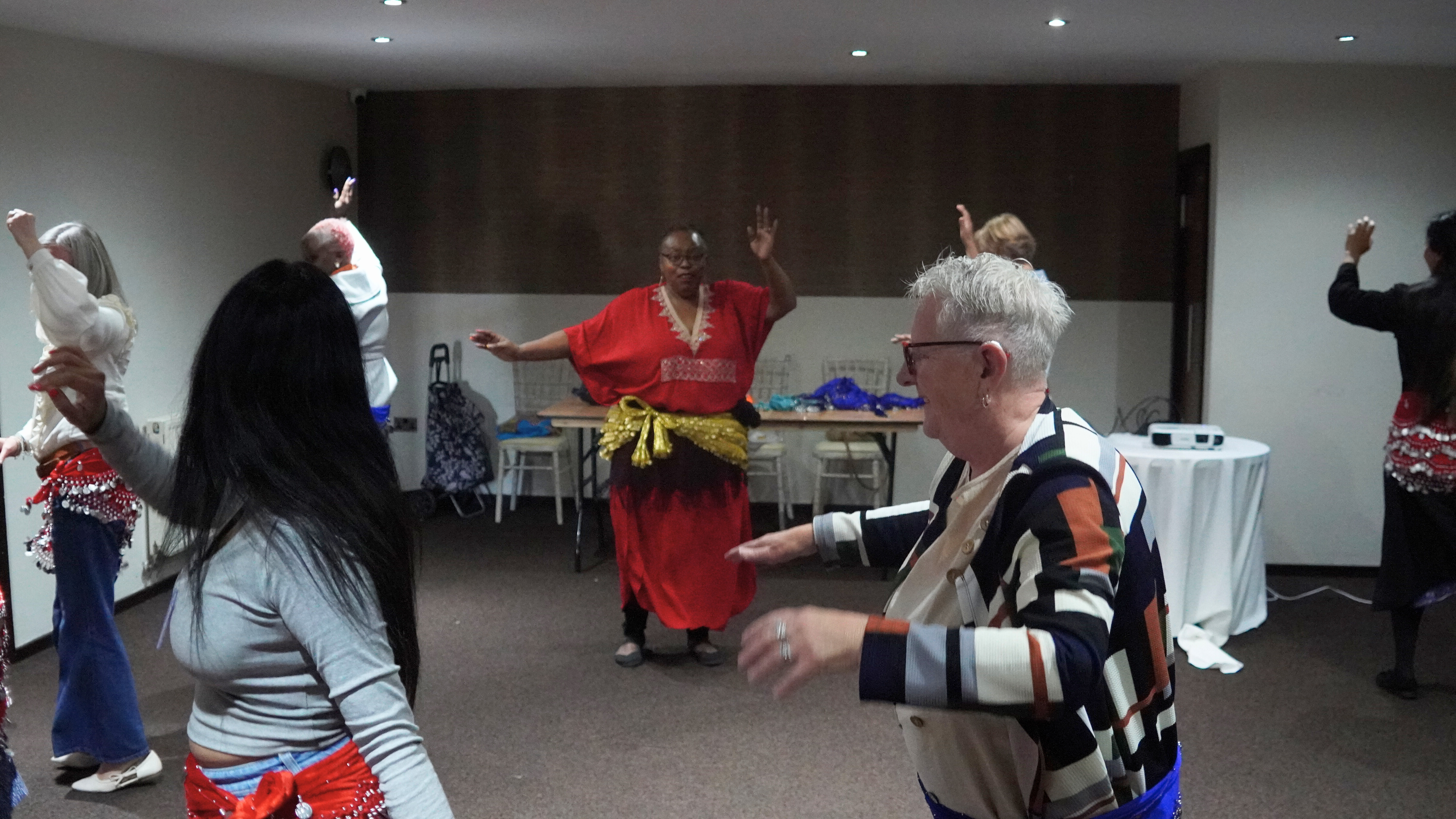 Attendees taking part in Belly Dancing Attendees taking part in Belly Dancing